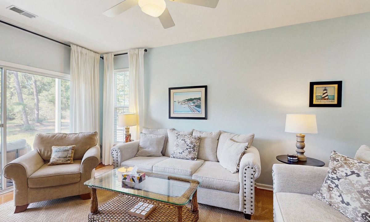 Sunset Beach Condo | 1st-floor corner condo with water view, on-site pool, & screened patio