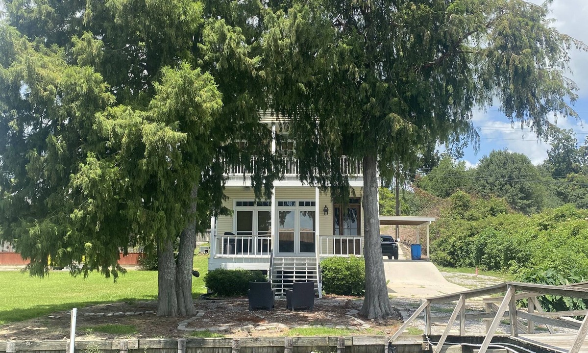 New Roads House | A fishing and swimming paradise . top tier lakeside house to enjoy