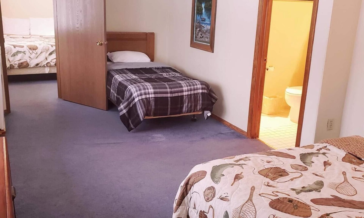Ironwood Cabin | A fun fishing themed private guestroom for up to 5 inside the Lodge at North Ironwood Acres resort. TWO bathrooms! DOG FRIENDLY!.