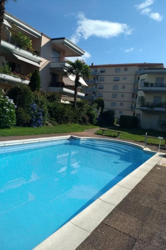 Caslano Apartment | Apartment 2 Zimmer Gartenwohnung mit Pool by Interhome