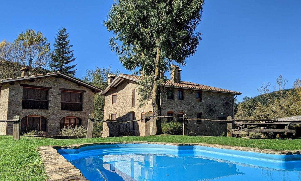 Santa Pau Apartment | Apartment 'Mas El Carrer - Blanc' with Shared Pool, Shared Garden and Wi-Fi