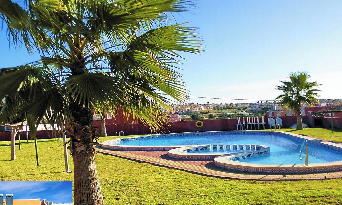 Orihuela Costa Apartment | Apartment with Large Roof Solarium, Pool, Garden, Barbecue, A/C & Wi-Fi