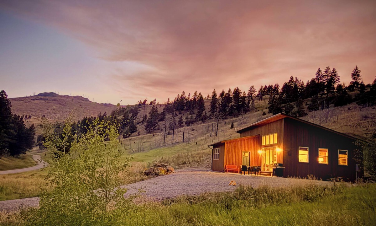 Emigrant House | Backroad Cabin cozy, private retreat, fireplace, backyard with fire pit and string lights.
