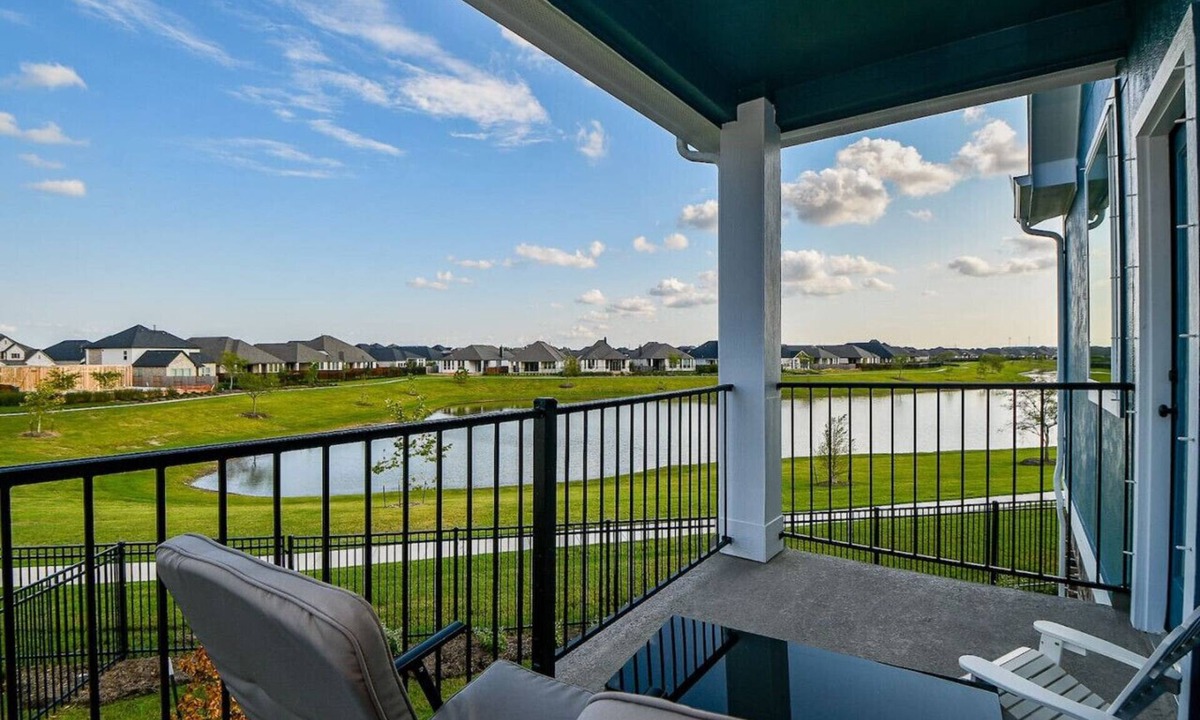 Iowa Colony House | Balcony with Serene Waterfront Views