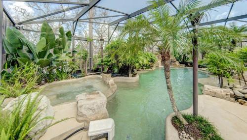 Marineland Acres House | Beach Home with Amazing Oasis Pool Spa Waterfall Fire Pit Bikes