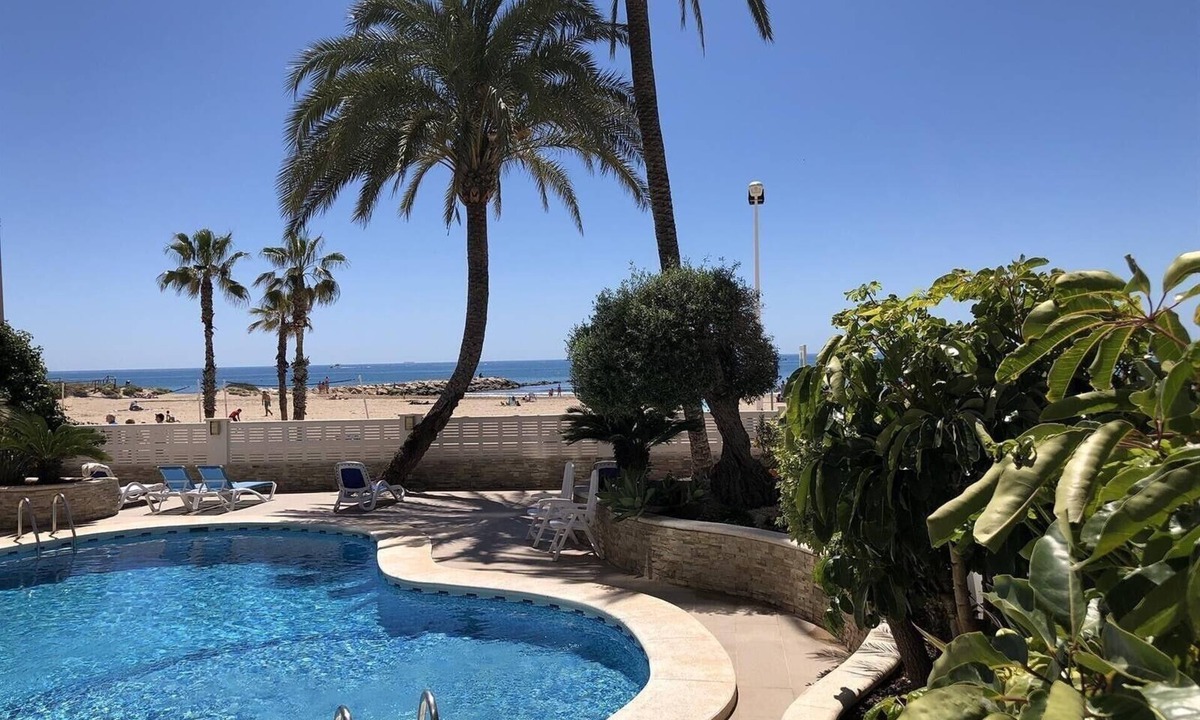 Calpe City Center Apartment | Beachfront Apartment with Sea Views, Pool, Garden & Wi-Fi