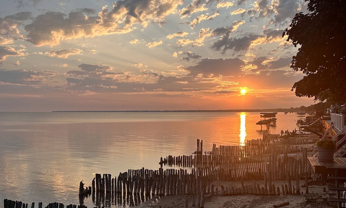 Pigeon House | Beachfront lake house with large deck, beach bonfire & stunning views!