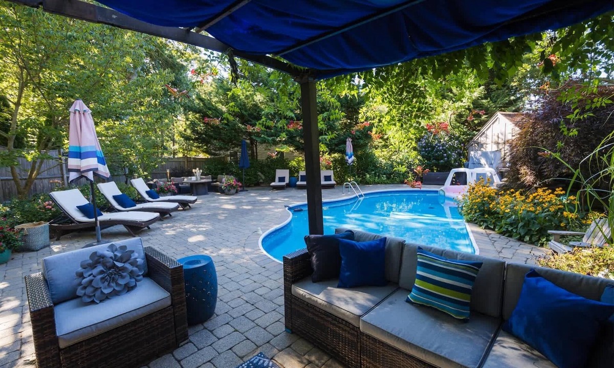 Eastham House | Beautiful Eastham home featuring lush gardens with heated in ground pool