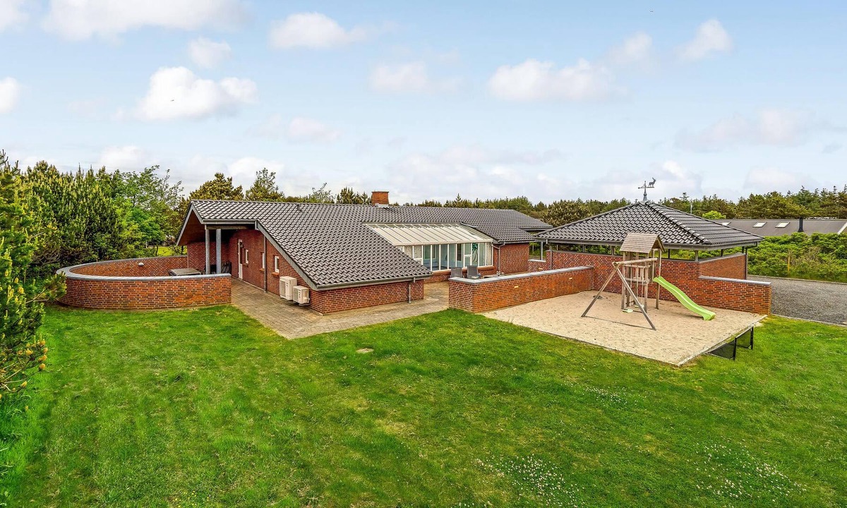 Vejers Strand House | Beautiful vacation home with pool on a large natural plot and placed in a well-established vacation