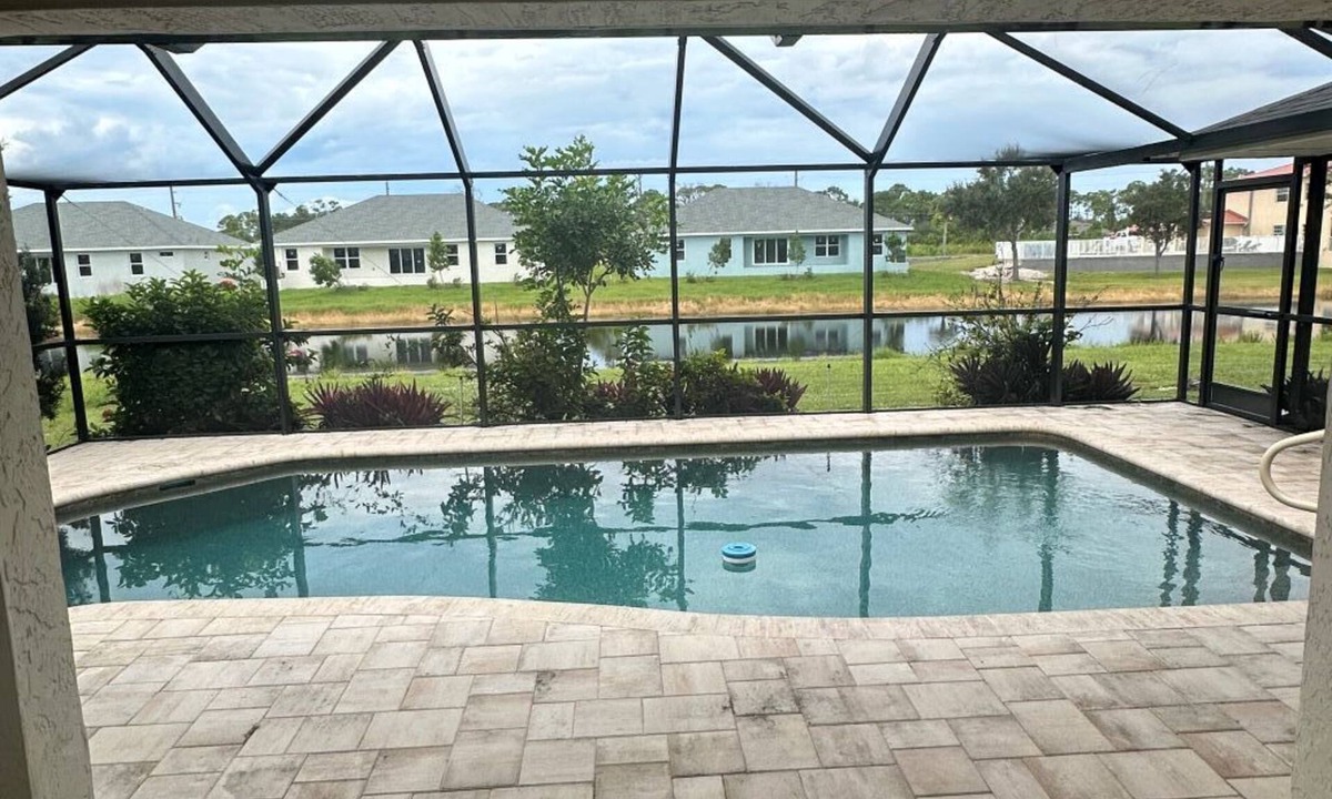 Pebble Beach House | Beautifully updated canal waterfront 3/2 house with heated pool in Rotonda West.