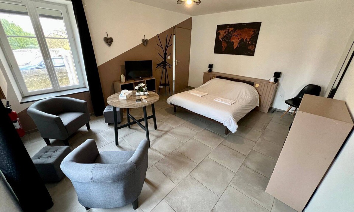 Lussac-les-Chateaux Apartment | Bedroom with private bathroom