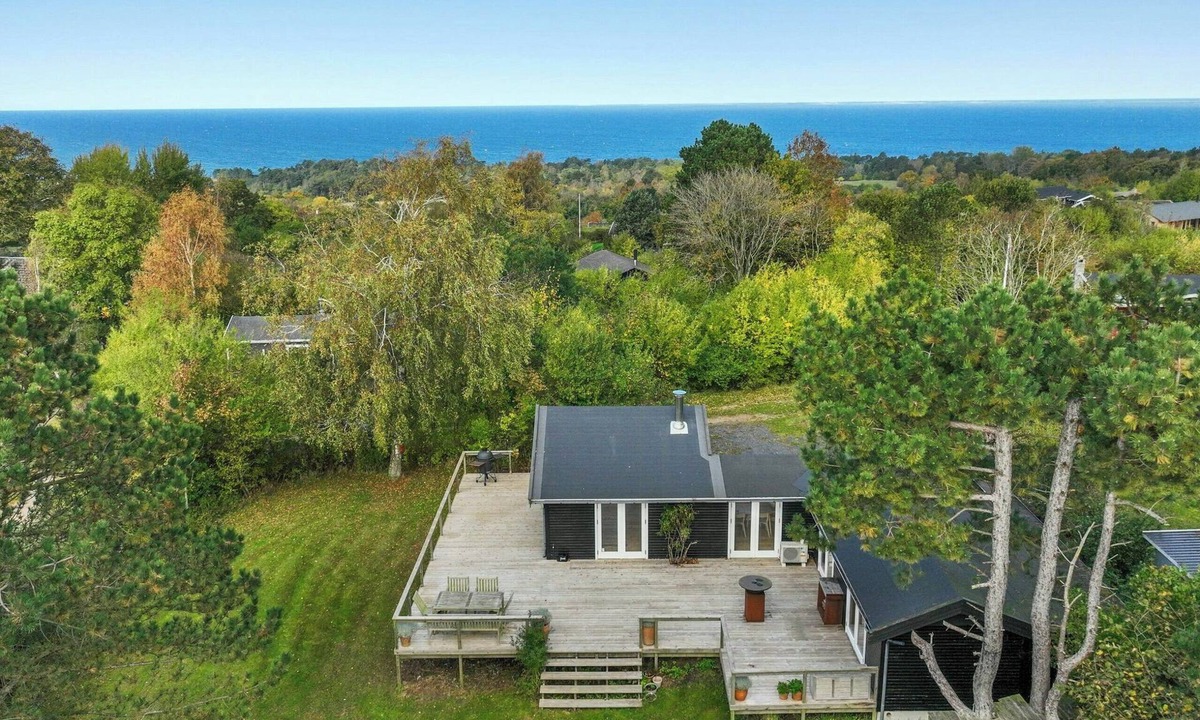 Faarevejle House | Black wooden house with panoramic views