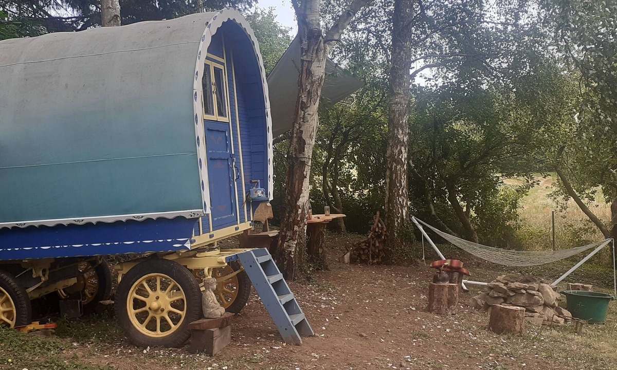 Belle-Isle-en-Terre House | Bow Top Wagon on forest edge