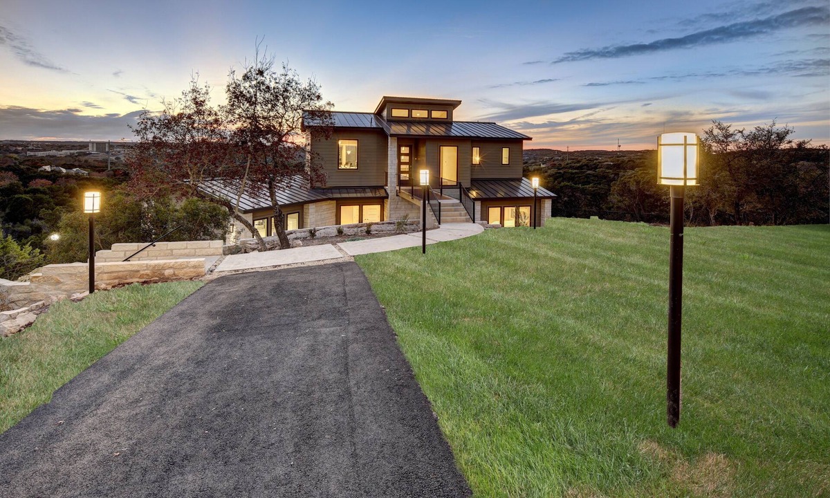Lost Creek House | Bridge to Happiness: Cross the entry bridge into a gorgeous 4 bedrooms residence