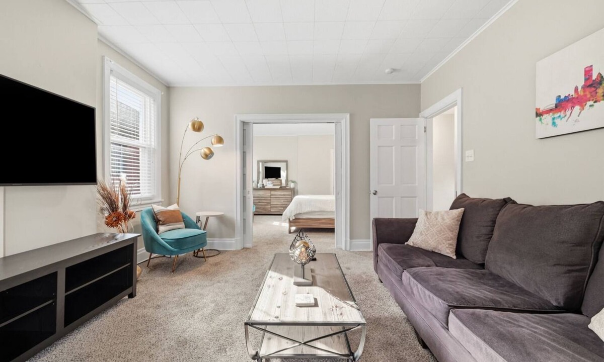 Brighton Heights Apartment | Bright 3BR near downtown with 2 private balconies, free parking, and a spotless, well-designed space. Easy access to stadiums, hospitals, and dining.