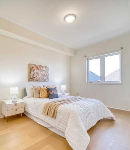 Richmond Hill Apartment | Bright bedroom with private bathroom