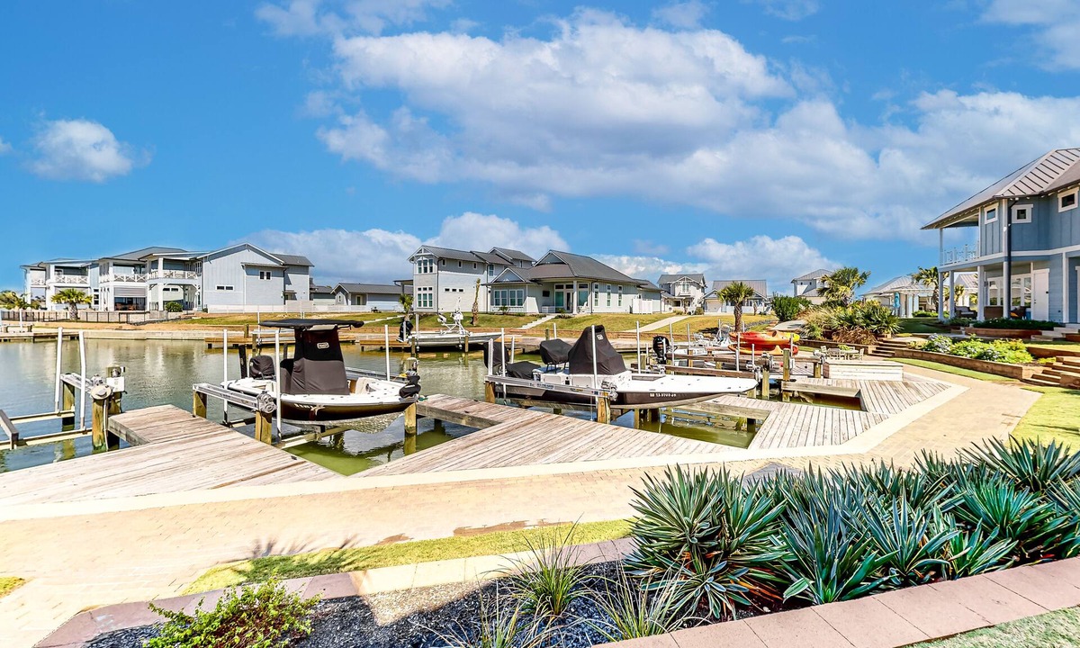Rockport Villa | Bright waterfront villa with pool, boat slip, patio & balcony in gated community