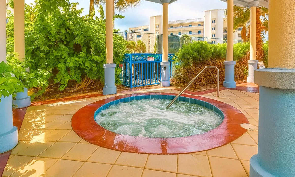 New Smyrna Beach Condo | Build family memories at this 3BR condo in New Smyrna Beach, just steps across the street from the sand. Enjoy a pool & spa outside your door, a luxe master bath, spacious bedrooms, and resort-style amenities in a gated community.