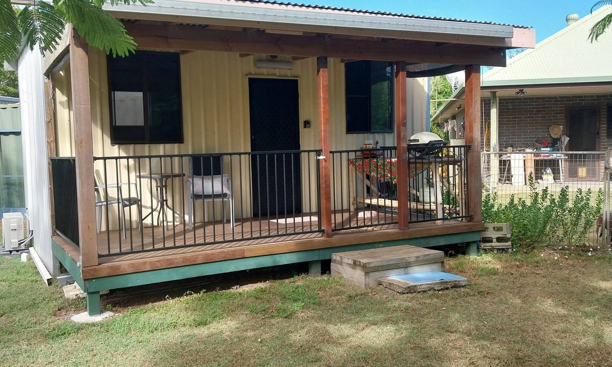 Coonarr Cabin | Bundaberg PETS A/C Small Rustic Cabin 1 bed kitchenette fridge bathroom BBQ deck