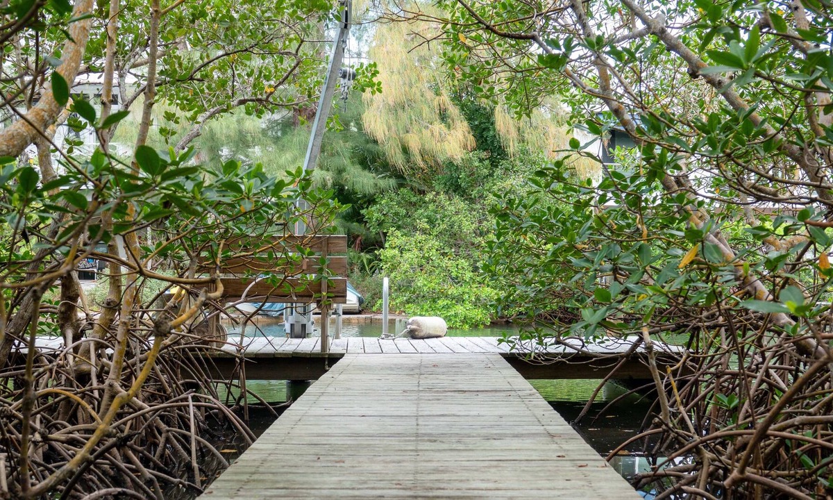 Bay Isle House | Canal-front home with a dock, GULF VIEWS, Shell Beach access.