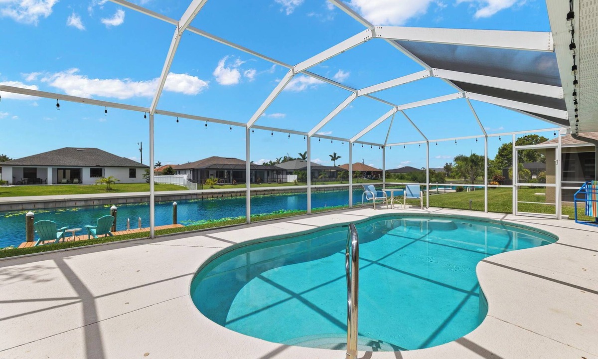 Trafalgar House | Cape Coral Canalfront Oasis: Private Dock, Heated Pool & Arcade Fun