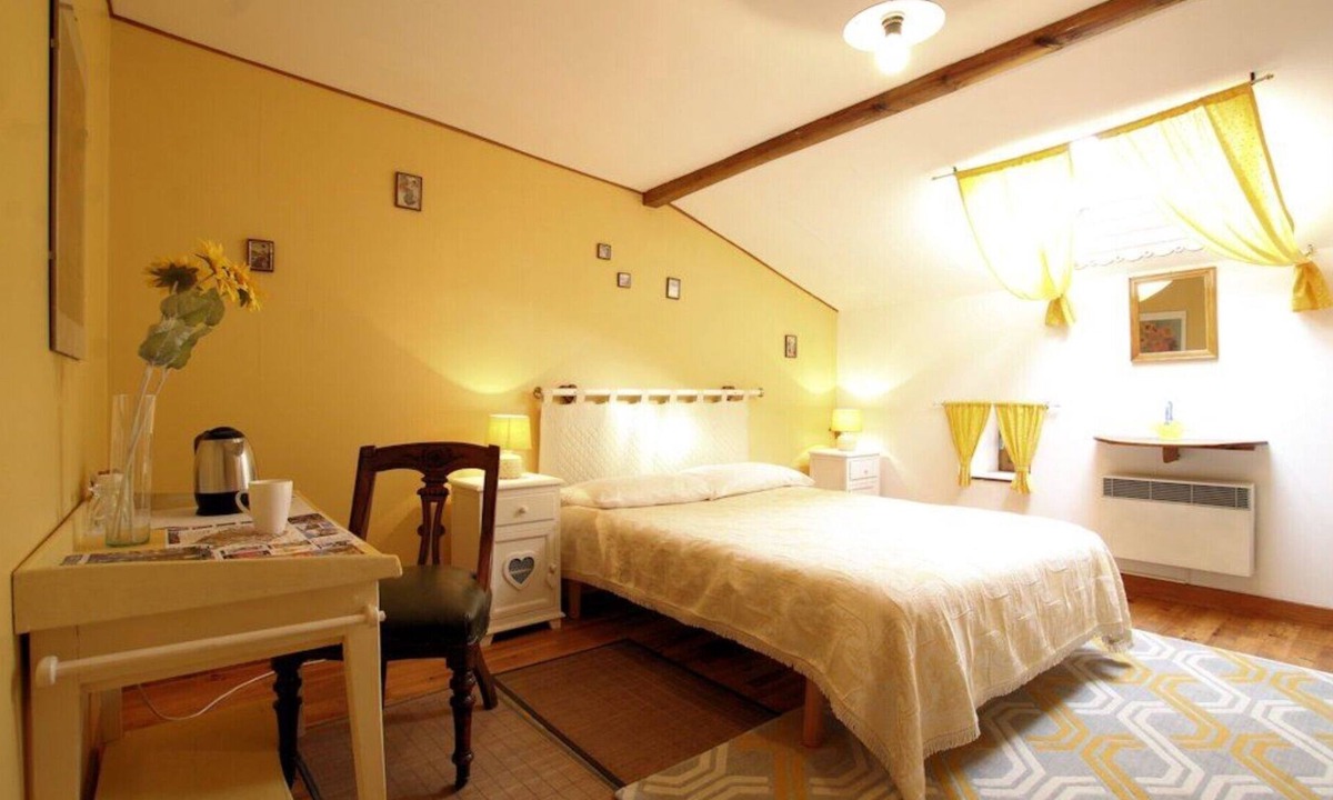 Polignac Bed & Breakfast | “Chambre Tournesols” Guest Room with Shared Terrace, Garden, and Wi-Fi