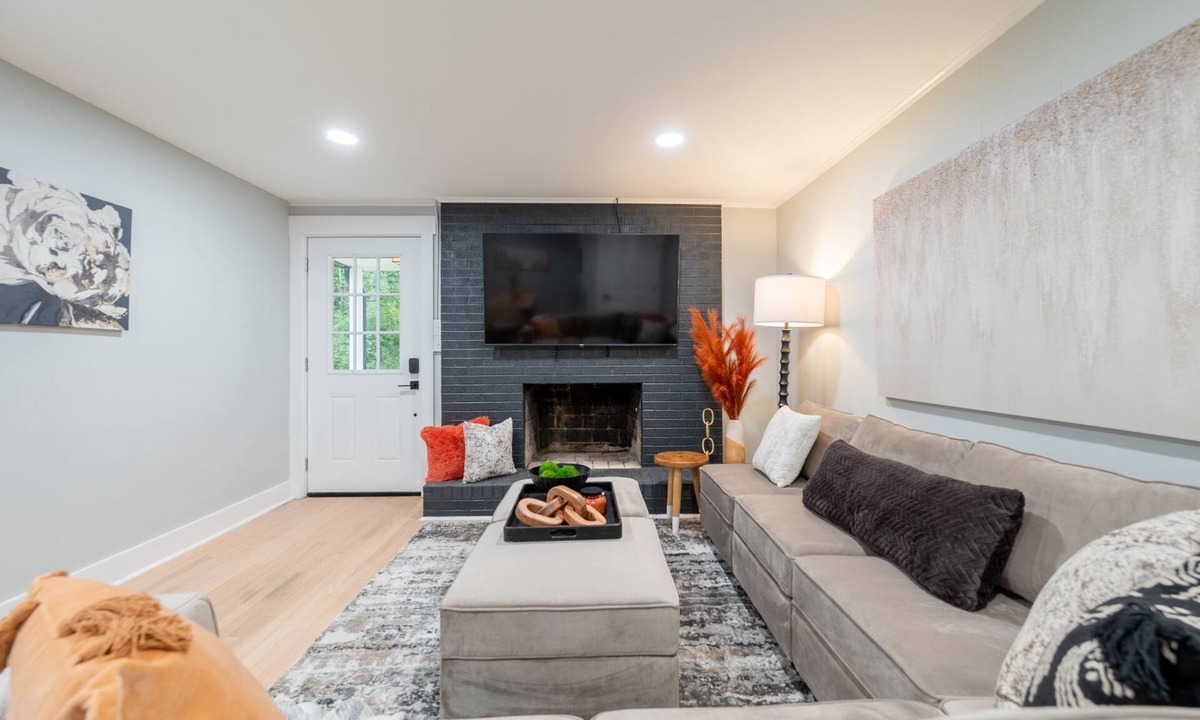 Blacksburg House | Charming cottage entrance with cozy curb appeal, nestled in a peaceful and green setting.