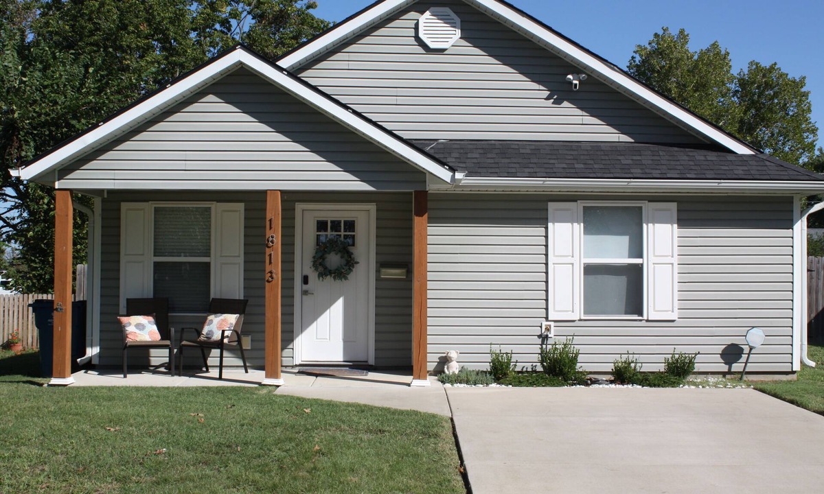 Joplin House | Charming home with firepit, large fenced yard, pet friendly.
