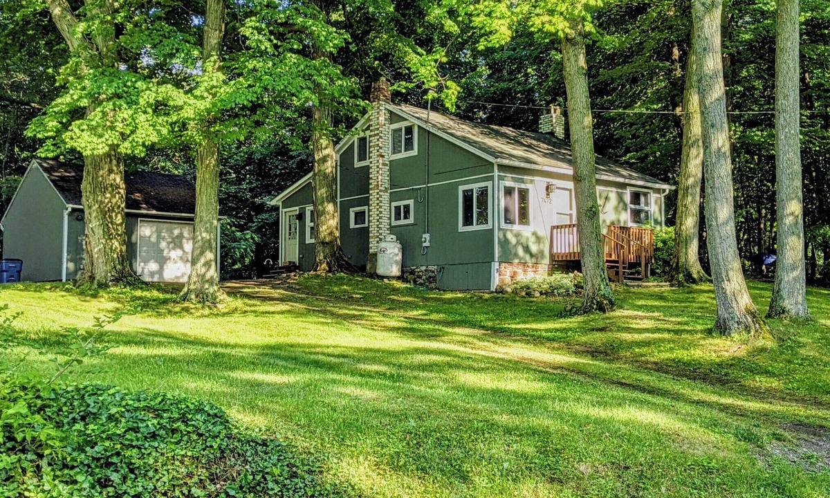 Wolcott Cottage | Charming Island cottage with dock, accessible by car and boat