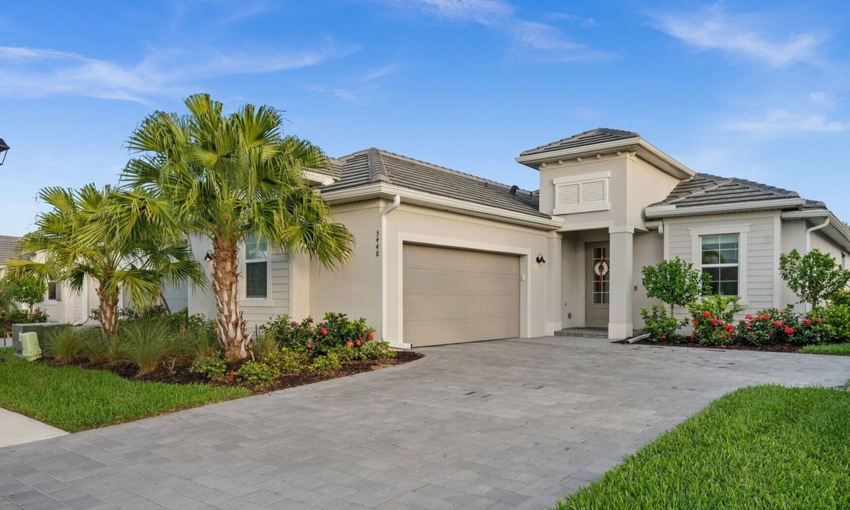 Immokalee House | Charming lakeside home with pool, spa and modern coastal design.