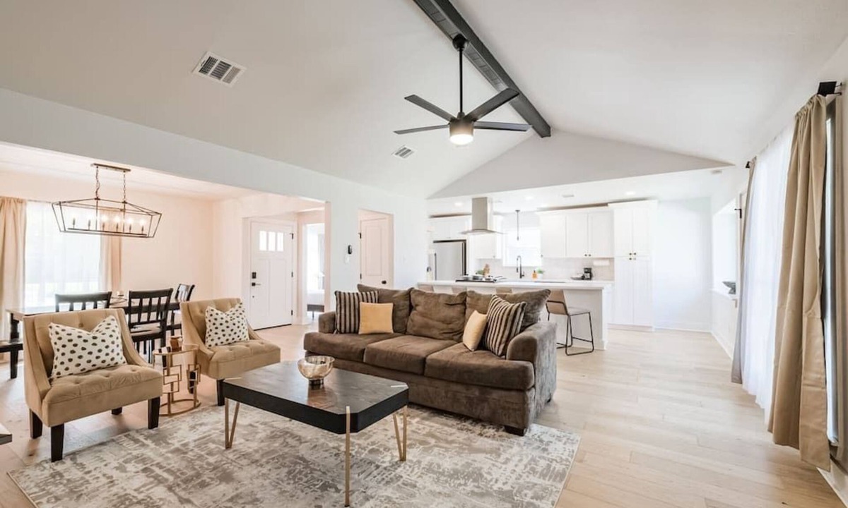 Garden Oaks House | Charming private home sleeps 8 with fenced yard, fast WiFi, smart TVs, large kitchen, and ample parking + 2-car garage—near the Heights & Downtown. Features a primary king ensuite for added privacy.
