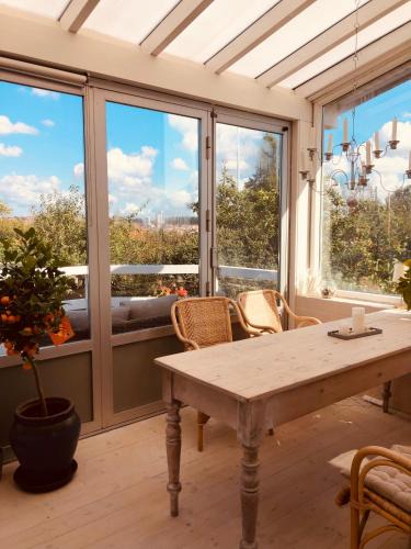 Randers Apartment | Charming sunroom with panorama view