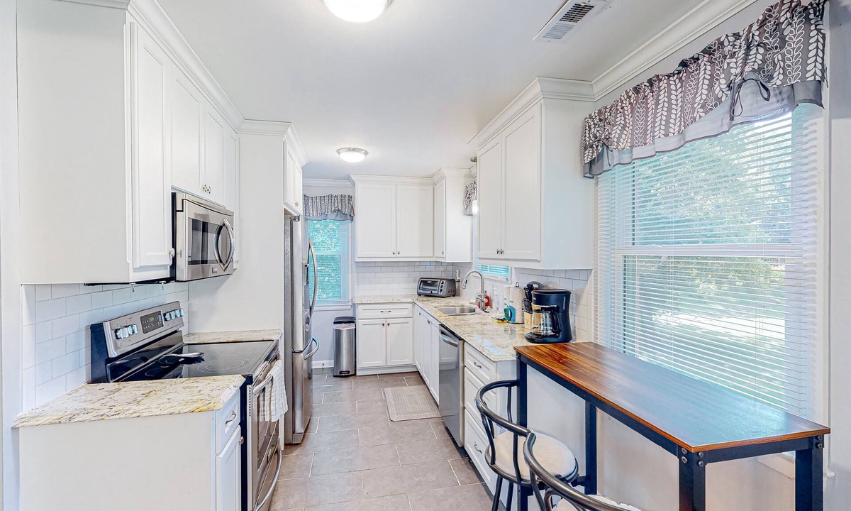 Blair Heights House | Cheerful dog-friendly home with a large yard, central AC, patio, & washer/dryer