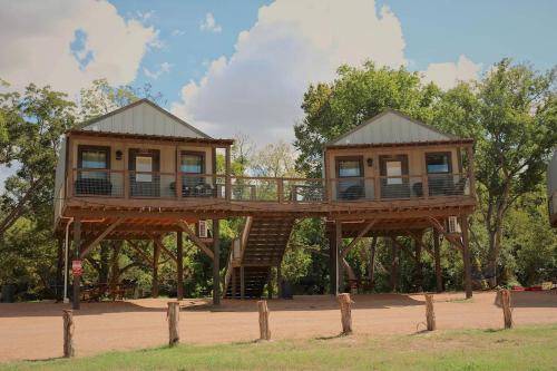 Sutherland Springs House | Cibolo's Family Oasis: Waterfront Tented Cabin Fully Loaded for Your Perfect Getaway