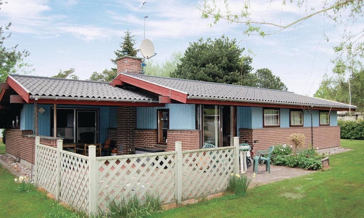 Gedesby House | Classic, practically furnished brick vacation home with inviting, fenced terraces and situated on be