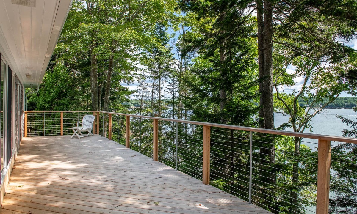 Harpswell House | Coastal Hideaway. Water views with expansive deck, pool table, office area.
