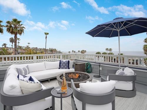 Beach Barber Tract House | Coastal retreat near the beach w Panoramic Ocean Views, Rooftop Deck, & Firepit