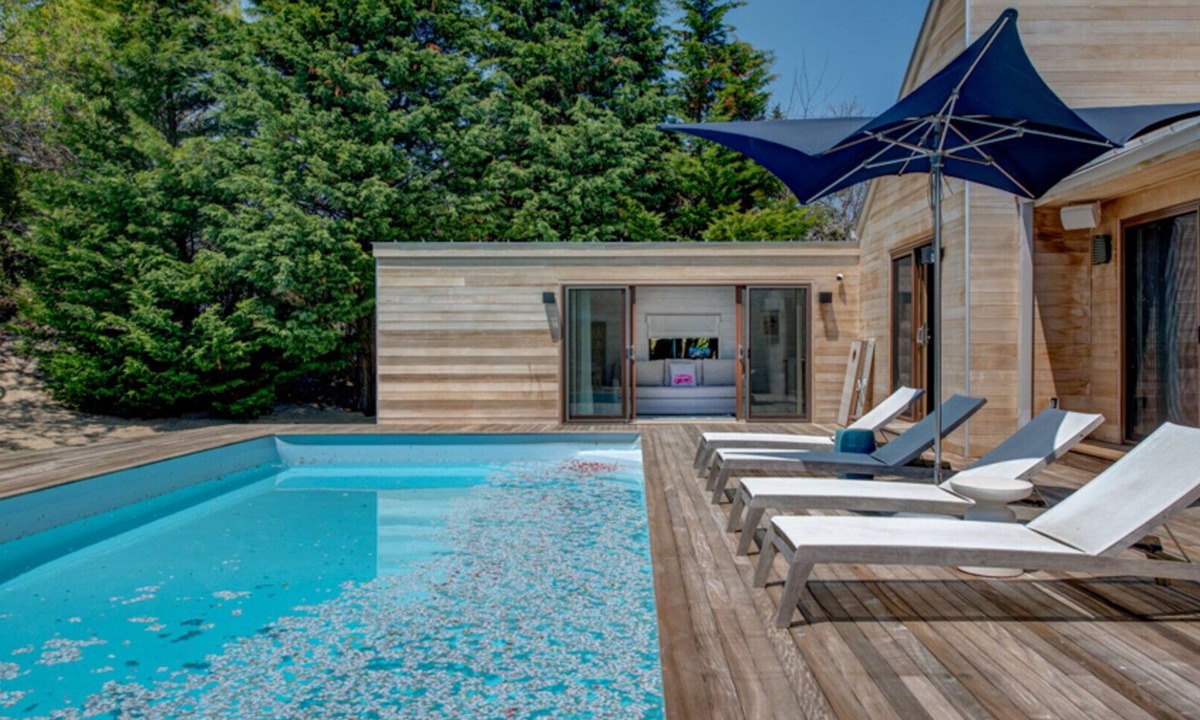 Beach Hampton House | Coastal-style home with private pool, open-floor plan, ample natural.