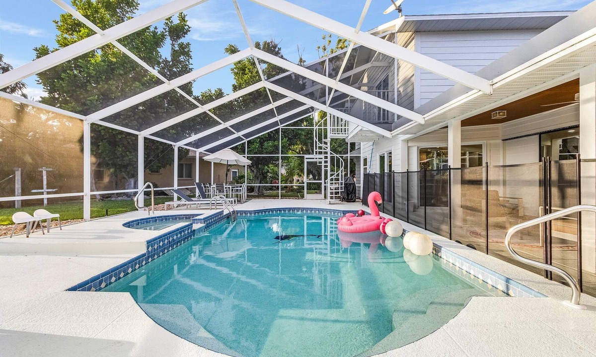 Pelican House | Coconut Cove Home with Sunny South-Facing Family Pool, Canal & Boat Dock
