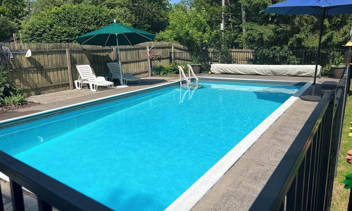 Penfield House | Comfortable Rochester Area Retreat Heated Pool, Hot Tub, 2 Kings & Fenced Yard