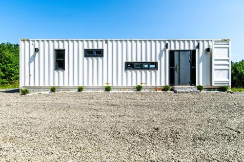 Littleton House | Container Home with Mountain Views Deck Fire Pit