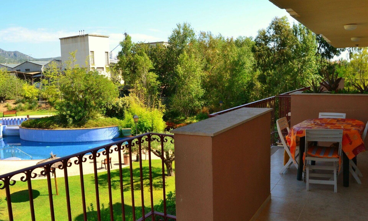 Sant Carles de la Rapita Apartment | Cosy apartment for 3 guests with pool, A/C, TV and balcony