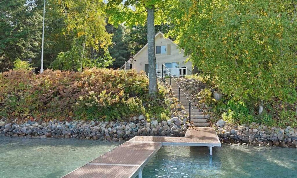 Boyne City House | Cottage with lake views, private dock & firepit - near public boat launch