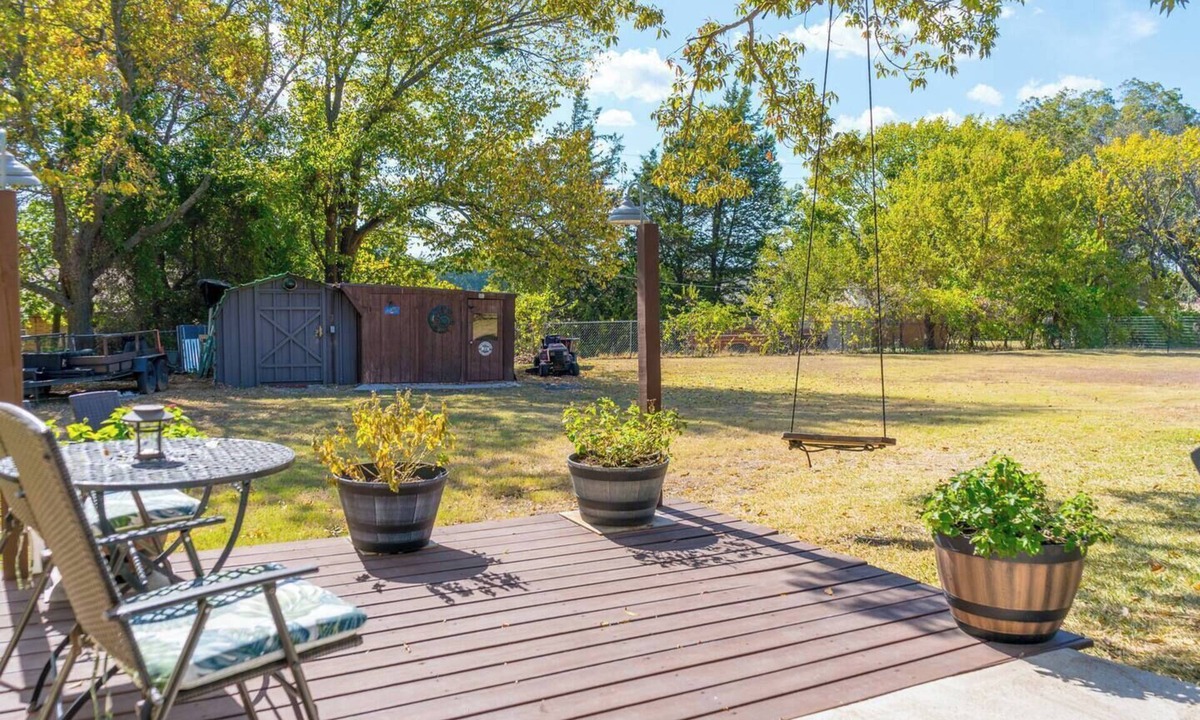 Saint Jo Cabin | Cozy downtown studio for 2 within walking distance to Red River Station. Features a king bed, kitchenette, smart TV, Wi-Fi, free parking, and a peaceful private patio.