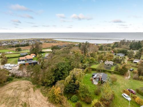 Logstor House | Cozy Holiday Home With Terrace And Wood-Burning Stove Close To The Water