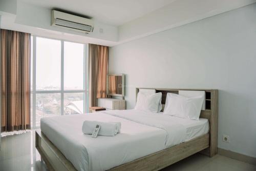 Cawang Apartment | Cozy Living Studio Room Apartment at H Residence By Travelio