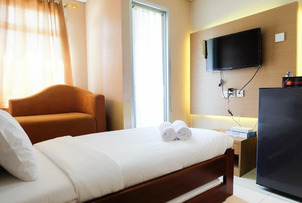 Sunter Apartment | Cozy Studio Green Lake Sunter Apartment By Travelio