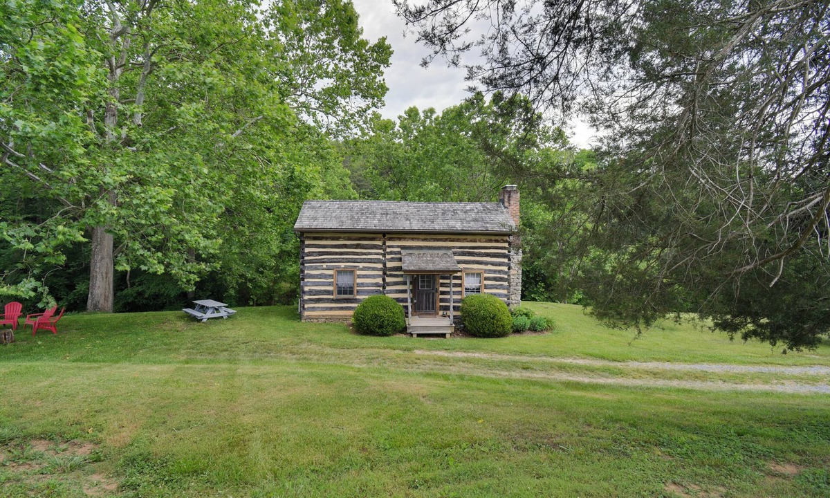 Raphine Cabin | Creekside historic log cabin w/modern amenities at historic Wade's Mill