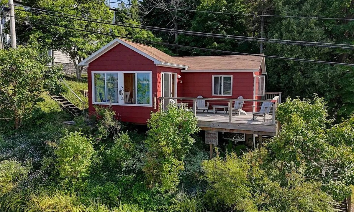 Sodus Point Cottage | Cute red cottage on the hillside overlooking Sodus Bay. Direct water access