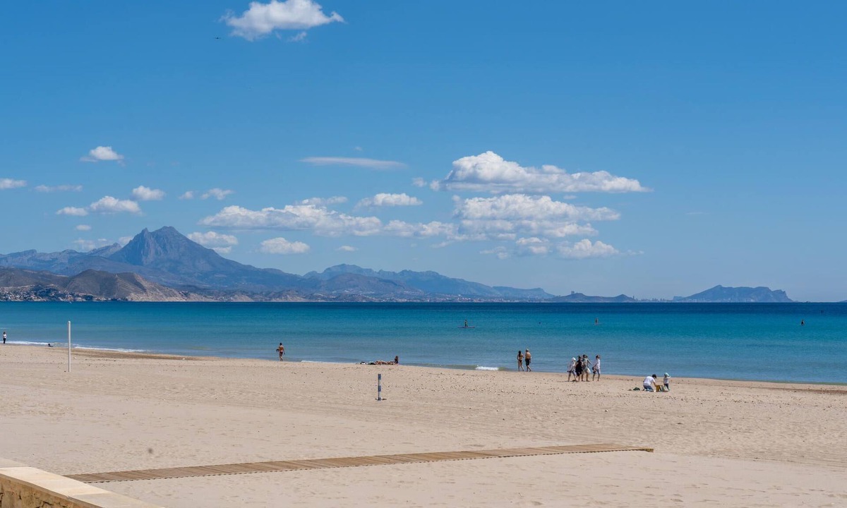 Muchamiel Apartment | Daylight friendly apartment with sea view and shared outdoor pool.